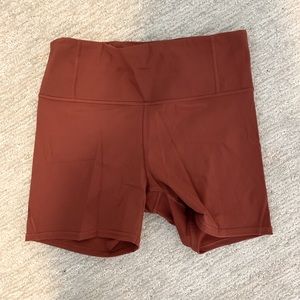 Athleta Lightning Bike Shorts (5 inch) in rust